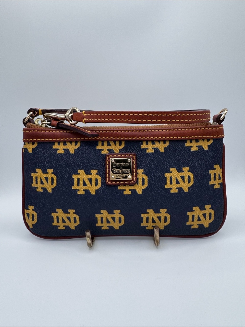 Authentic Dooney & Bourke Navy and Gold Notre Dame Logo Wristlet with Brown Trim
